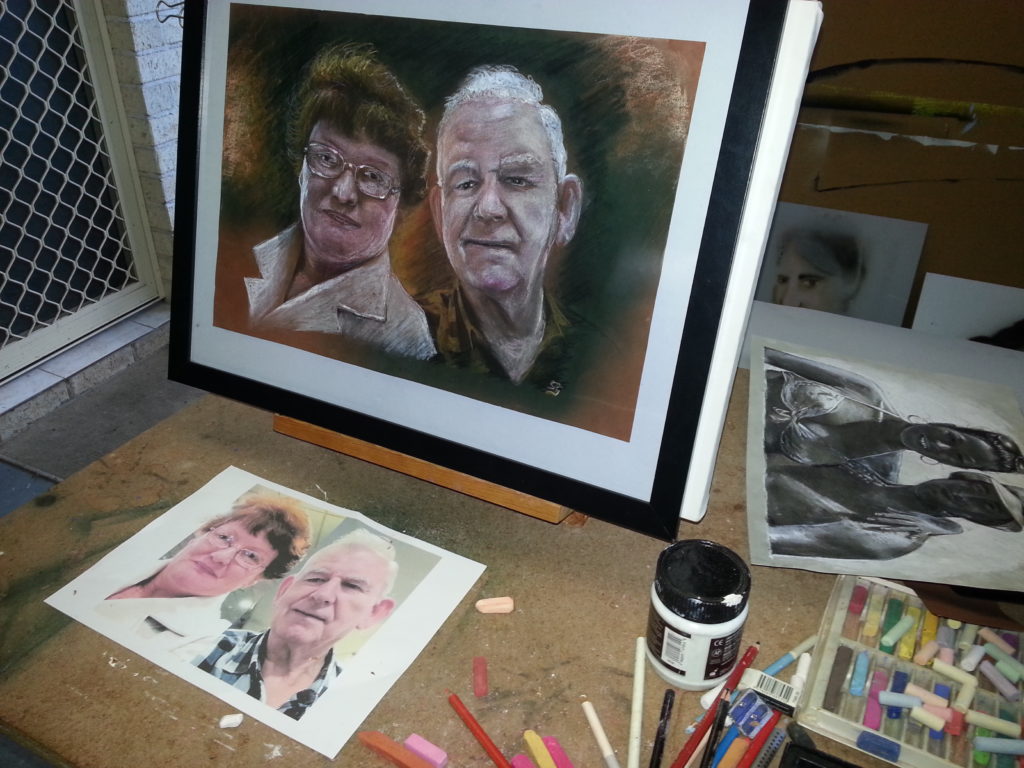 faces of an older couple. pastel portrait designed by a portrait artists in Brisbane