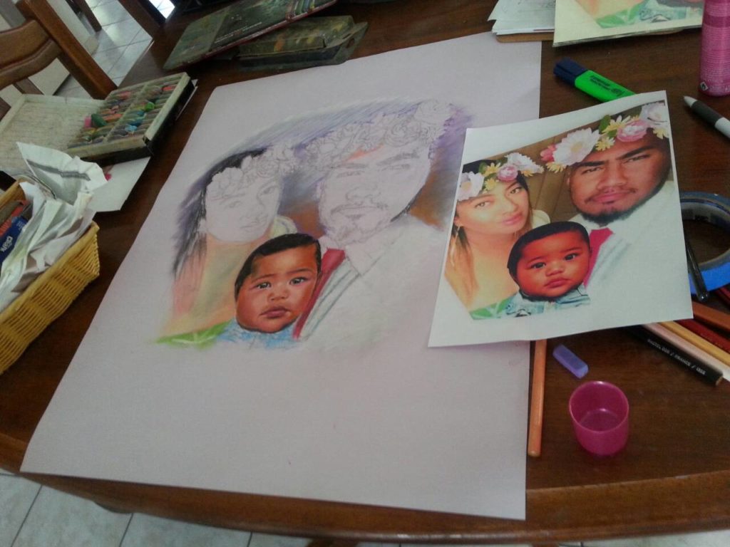 Step 2 artist creating pastel portrait of family of 3