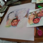 Step 2 artist creating pastel portrait of family of 3